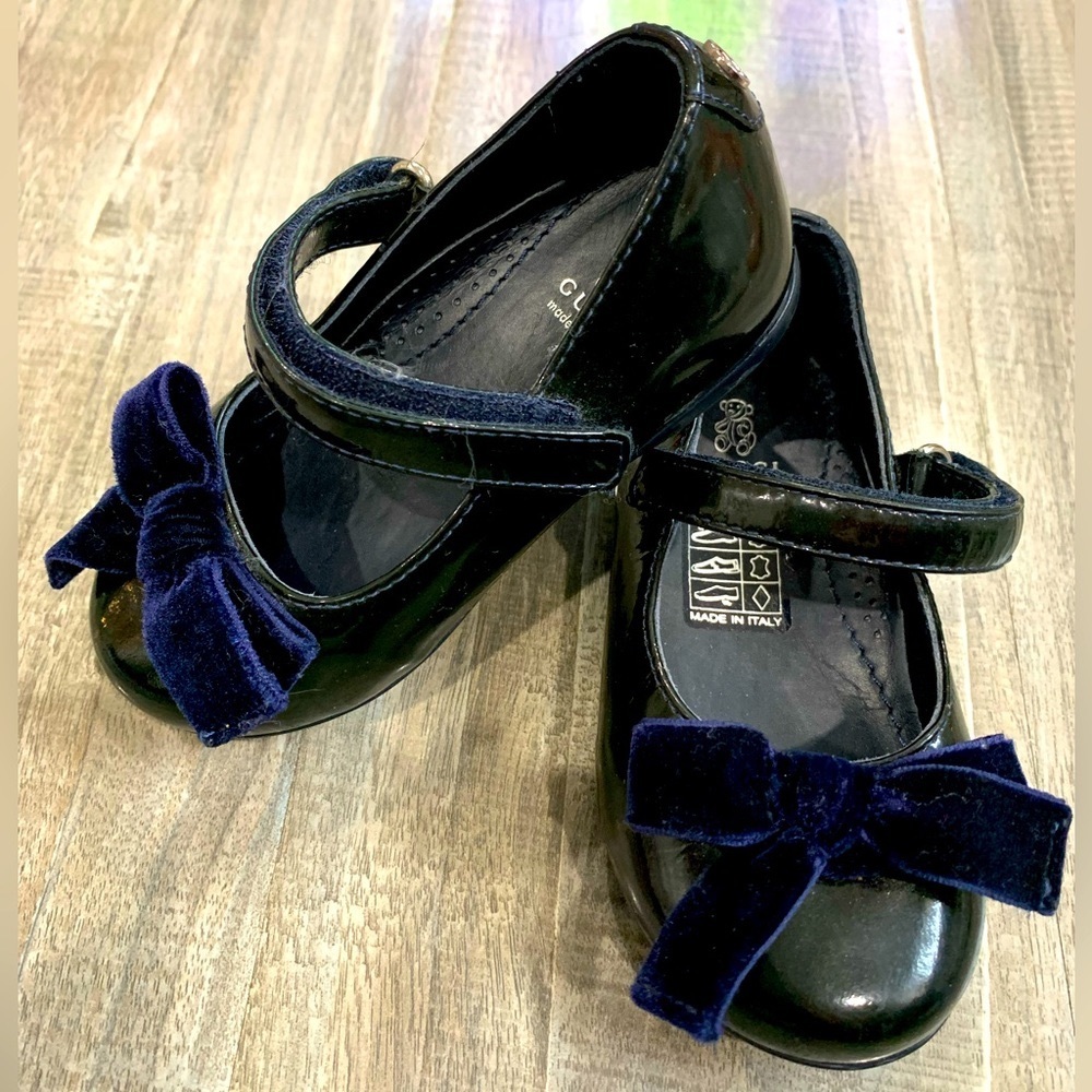 Blue/black Mary Jane style toddler shoes.